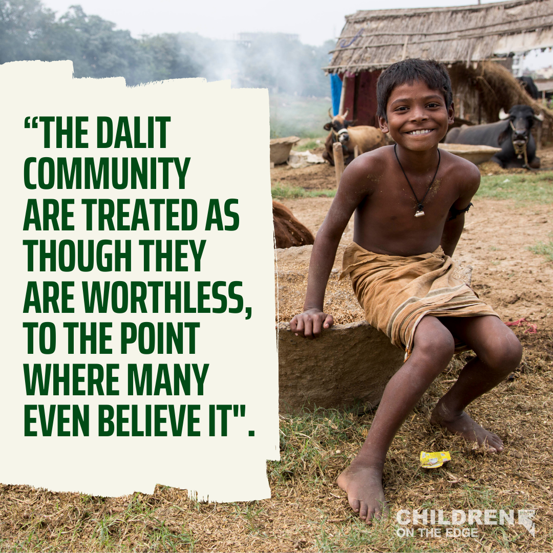 A Dalit child outside in Patna and the words 'the Dalit community are treated as though they are worthless, to the point where many even believe it'