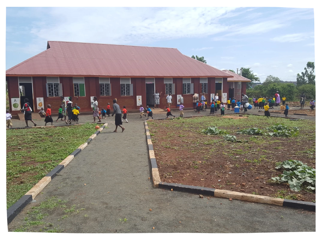 New ECD building in Loco with children playing outside