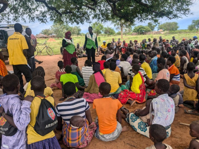 Children on the Edge Africa talking to a community about early year education