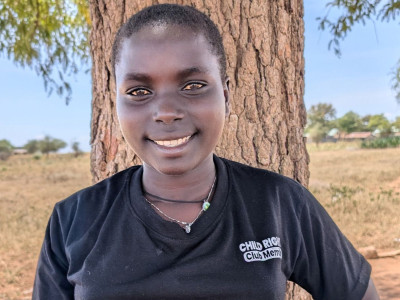 Nivea standing in front of a tree smiling