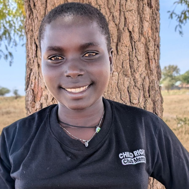 Nivea standing in front of a tree smiling
