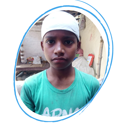 Arti, a 14 year old Dalit girl from India is wearing a white hat covering her hair and a green tshirt. She is looking at the camera with a neutral expression.