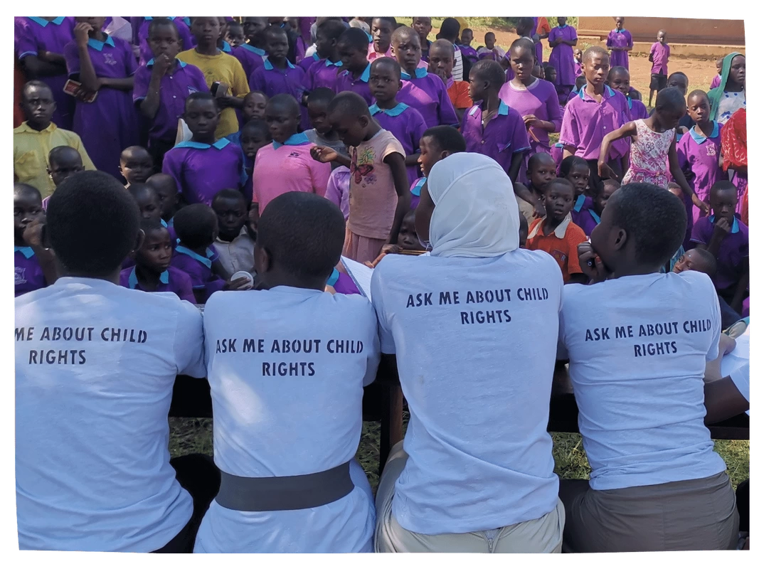 PictureWorkshop in Uganda with children wearing 'Ask me about child rights' tshirts