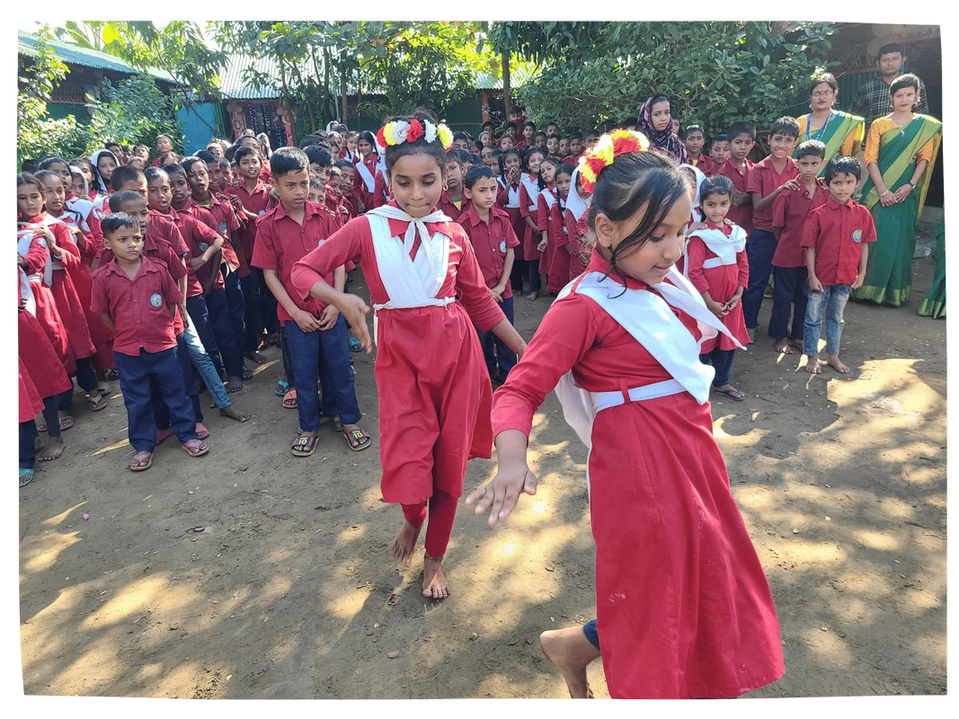 Children dancing in their school garden