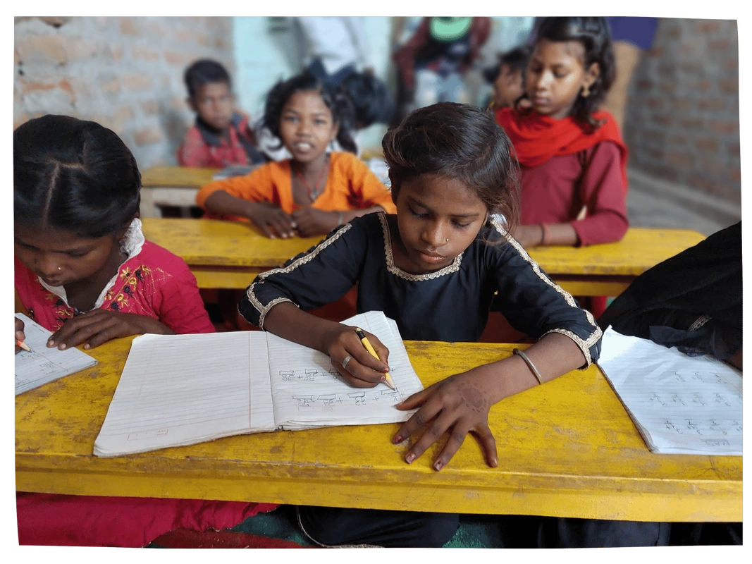 Children learning in a classroom in India