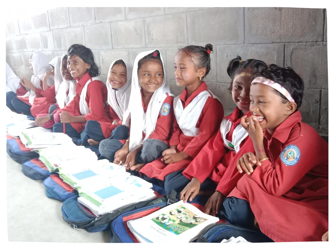 Children smiling in Bhasan Char classroom