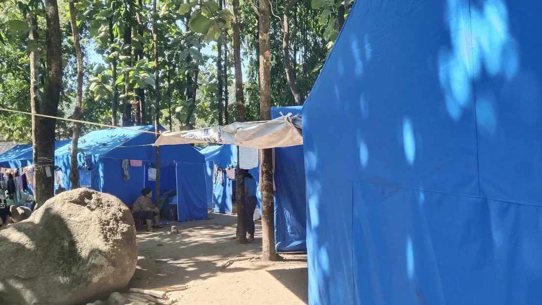 Blue tents shelter families displaced by conflict