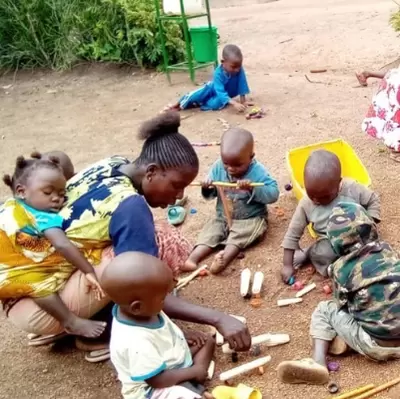Young Congolese children building and playing with sticks