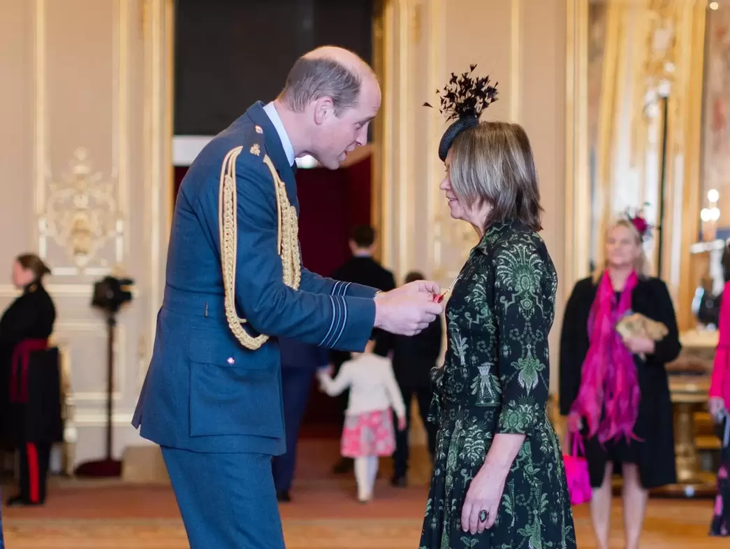 Rachel Bentley receiving OBE award from HRH Prince William