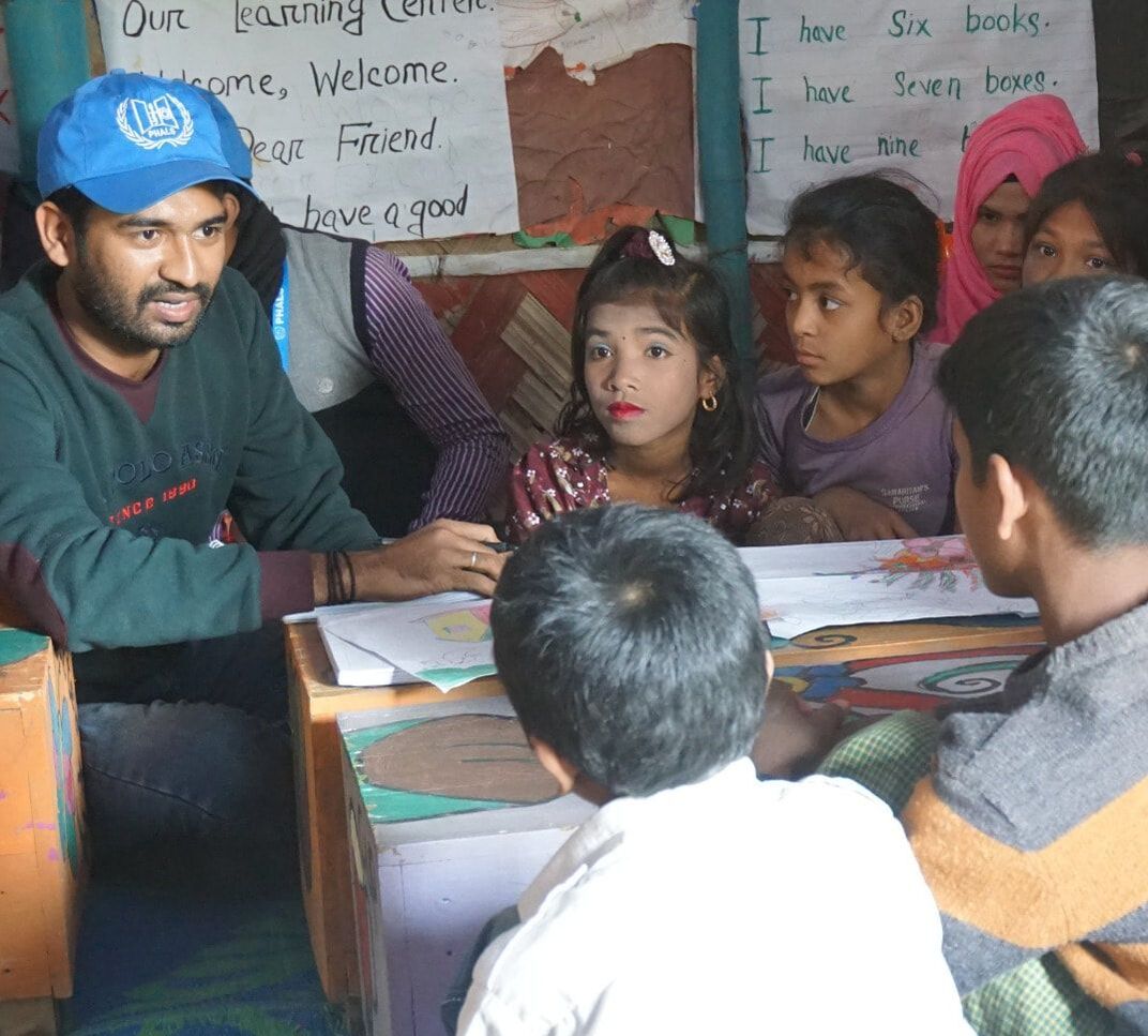 Somorjit Das Raju holding a focus group with children from the Learning Centres.