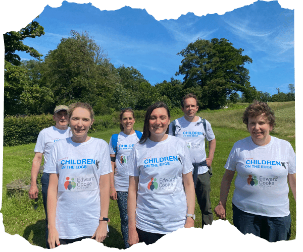 Six fundraisers wearing children on the edge tshirts standing together before they take on a walking challenge