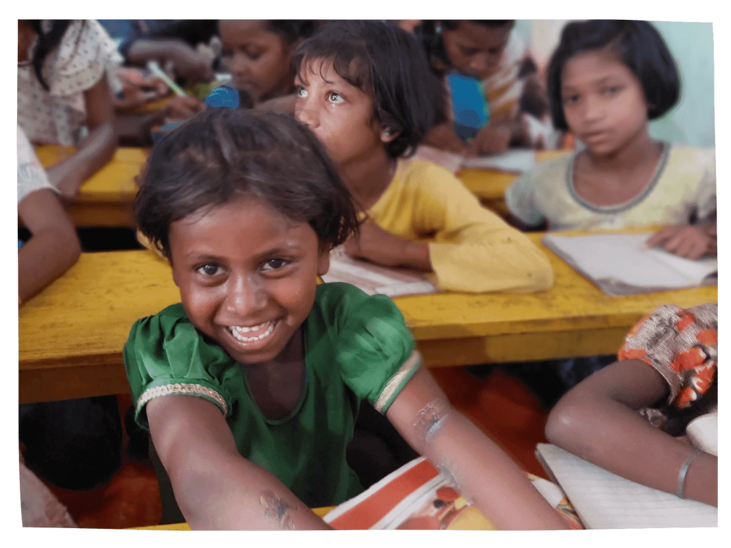 Dalit girl smiling in class