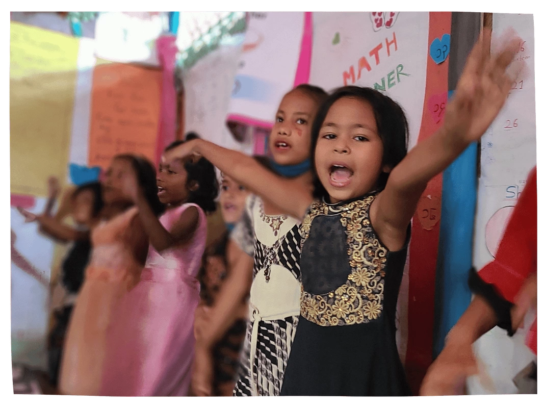 Rohingya children dancing in classroom