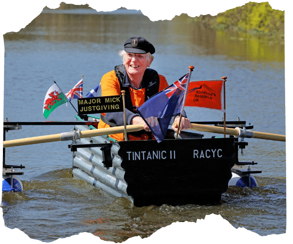 Major Mick rowing his tin boat along the canal as part of his fundraising challenge