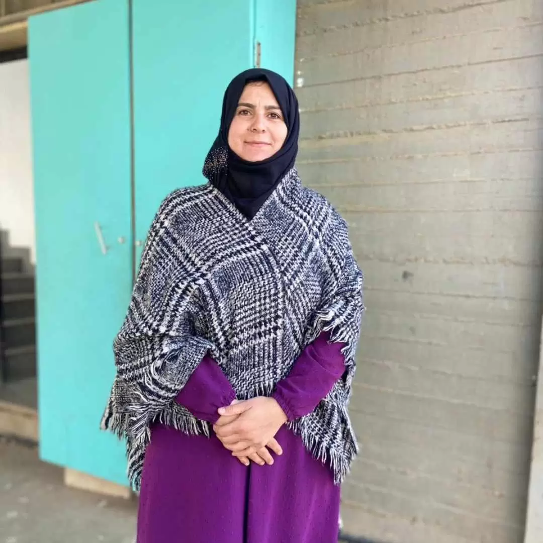 Teacher Mayassa standing outside the school in Lebanon