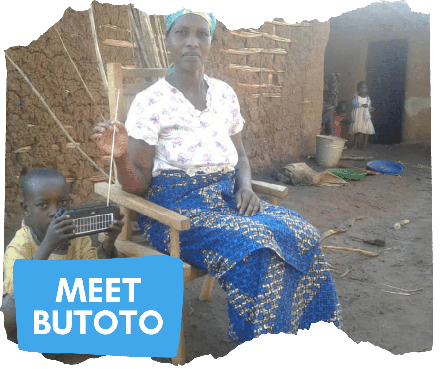 Butoto and her son Ndahaye sat outside their house in Kyaka II refugee settlement listening to a solar powered radio. Bututo is a Congolese woman dressed in a blue skirt, white shirt and a blue headscarf. Ndahaye is a child aged around 5 who is sat down on the floor next to his mother holding the radio. 