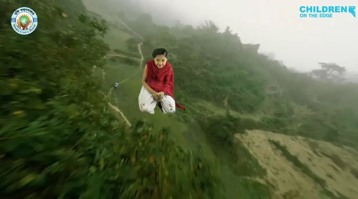 Rohingya child is on a broom flying over lush green landscape, created in a green room