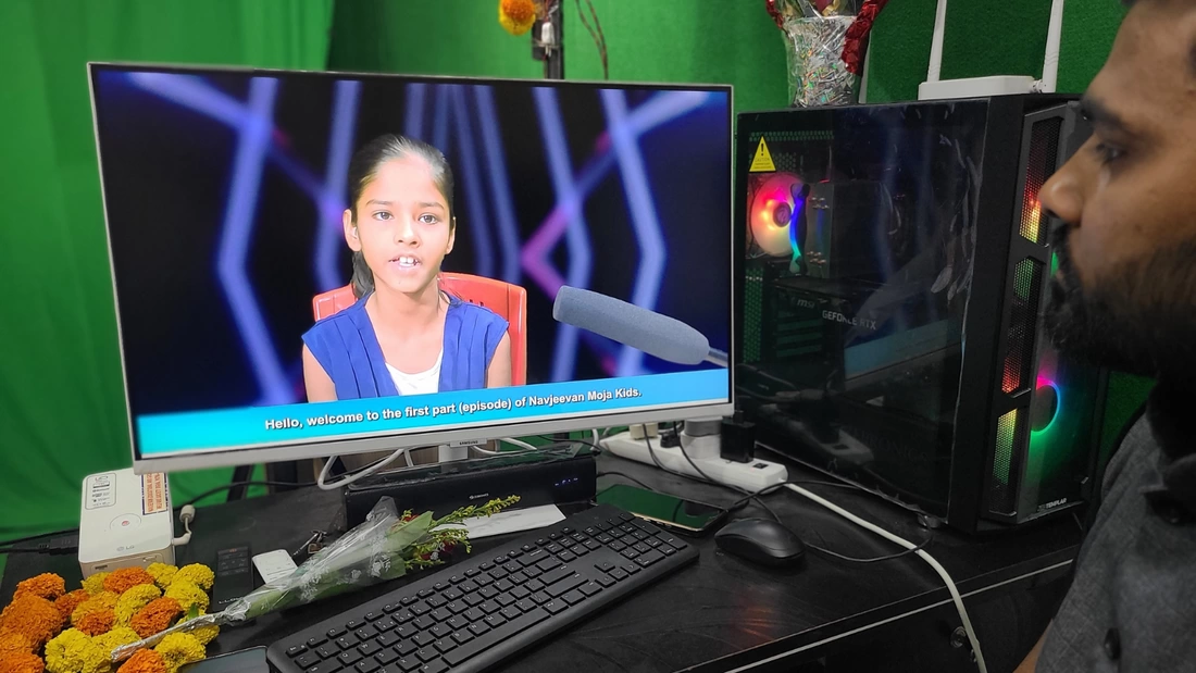 A computer screen in a green screen studio showing the first Moja kids episode filmed by children in Patna India