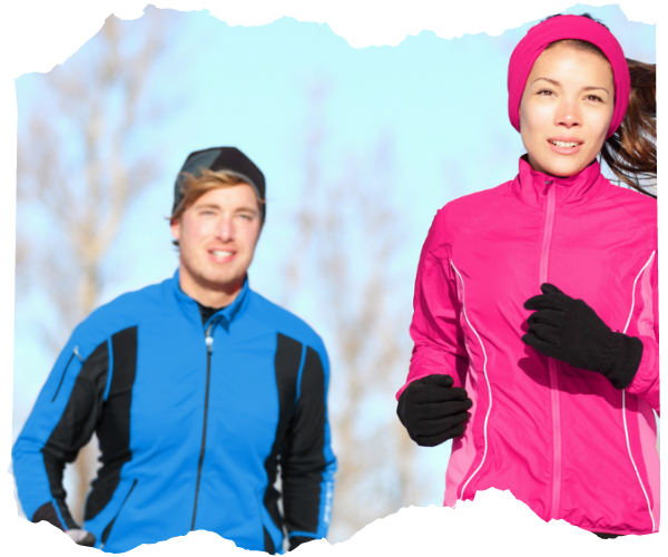 Two runners, a man and a woman, both wearing gloves and bright jackets.