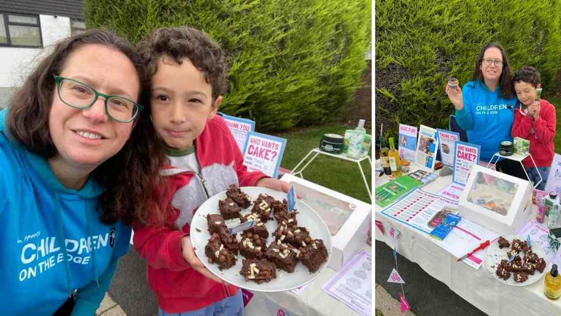 Raquel and her son outside on their driveway with their cake stall 