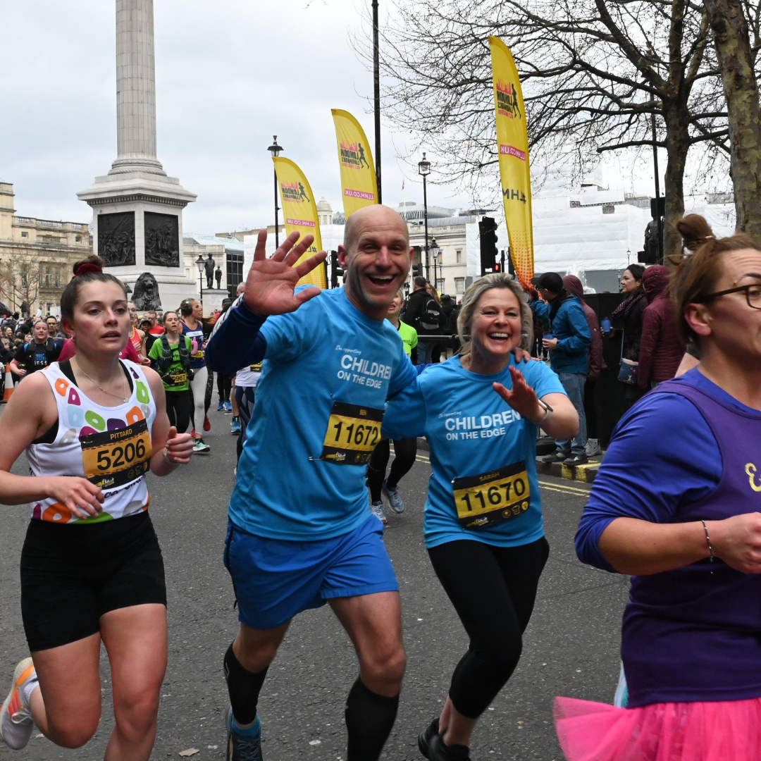 Ben and Sarah Smiling and waving during the London Landmarks race