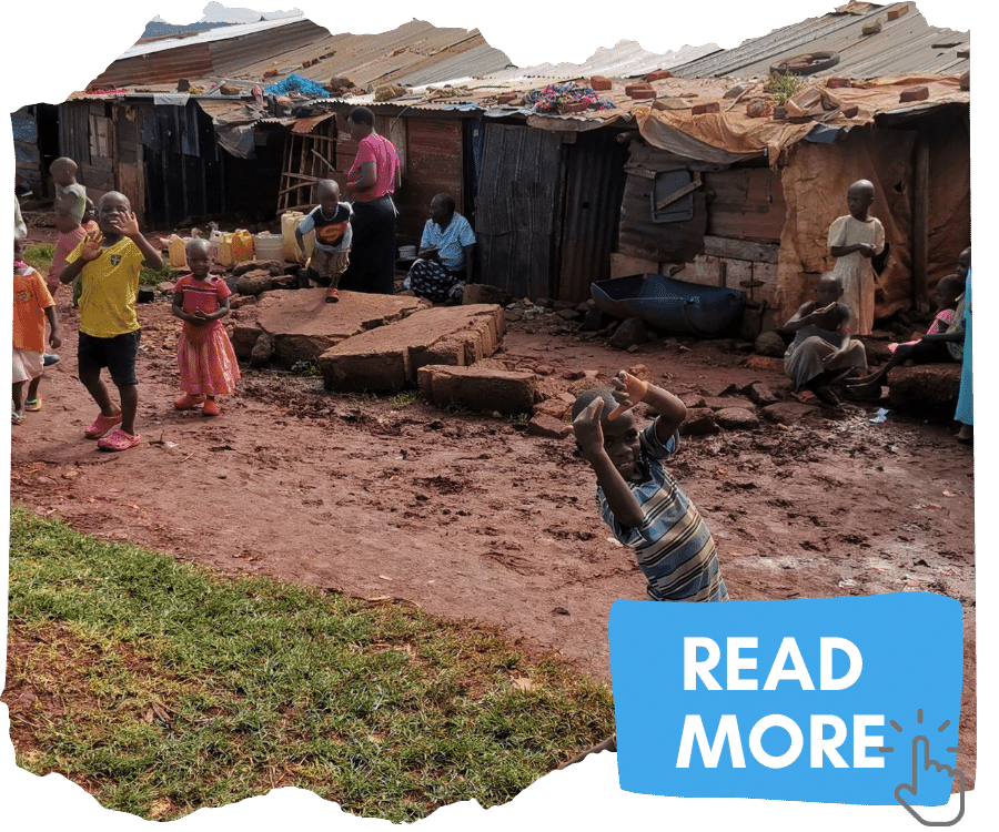 Slum community in Jinja, Uganda - makeshift shelters line a muddy path with children playing outside. You can click on the image to read more about our work with slum communities. 