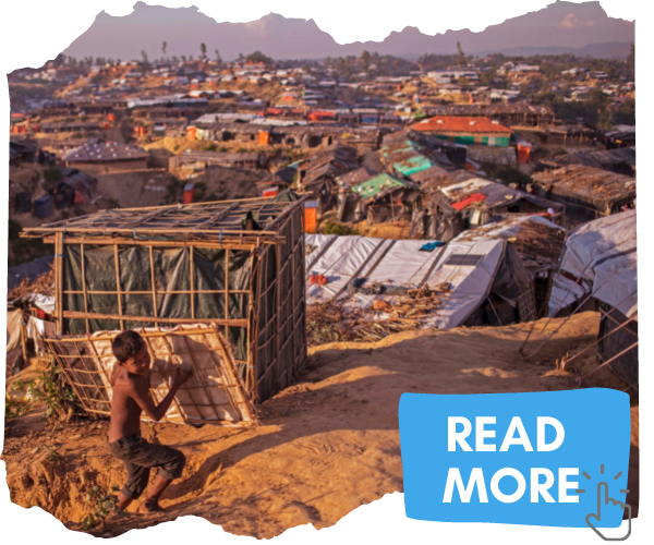 Scene of Kutupalong mega camp shortly after the August 2017 genocide. Photo shows miles of hastily constructed tents of sticks, mud and plastic and a small boy carrying a a slatted piece of wall. You can click the image to be taken to a separate piece about the Rohingya. 