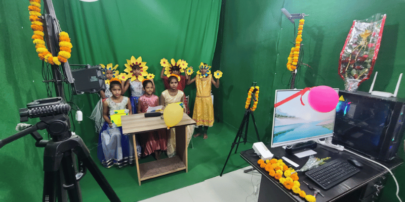 Children in a green room recording a Moja Kids newsletter